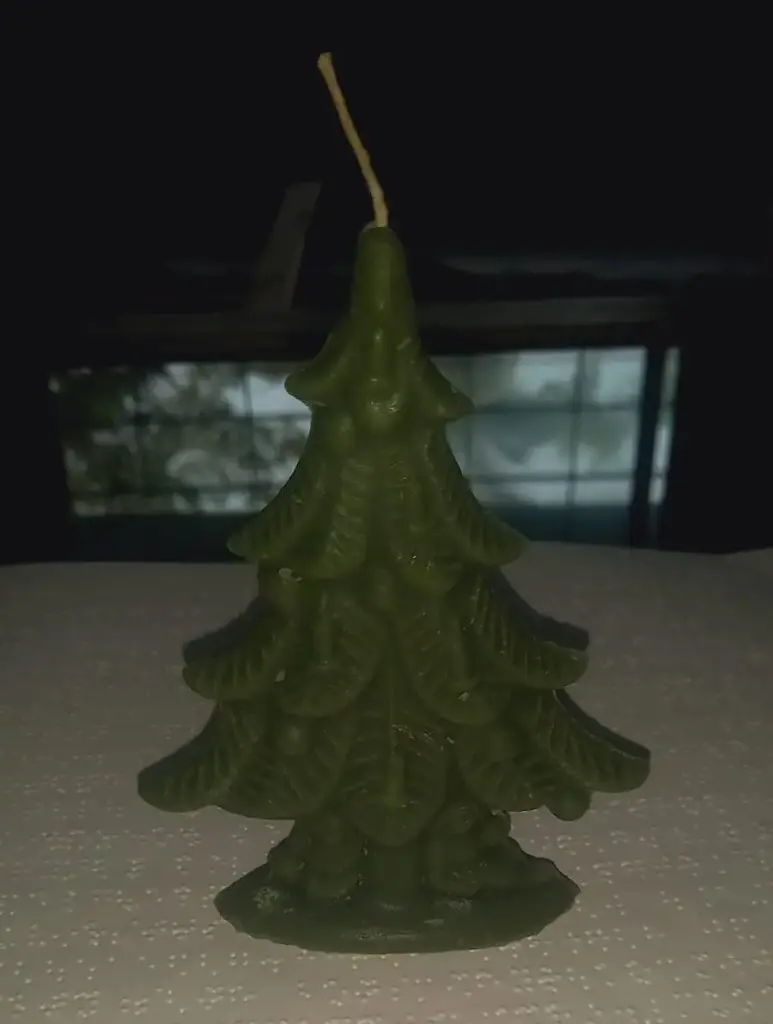 green chistmas tree shaped candle